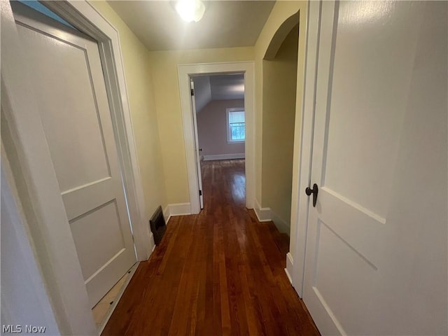 hall featuring dark wood-type flooring