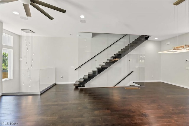 interior space with dark hardwood / wood-style floors and ceiling fan