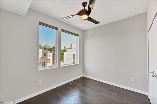 spare room featuring ceiling fan and hardwood / wood-style floors