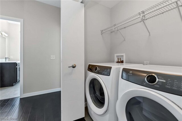 laundry room featuring independent washer and dryer, sink, hookup for a washing machine, and hardwood / wood-style floors