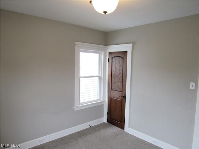 spare room with light colored carpet