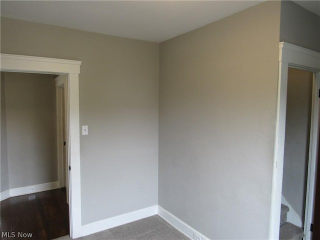 empty room with carpet flooring