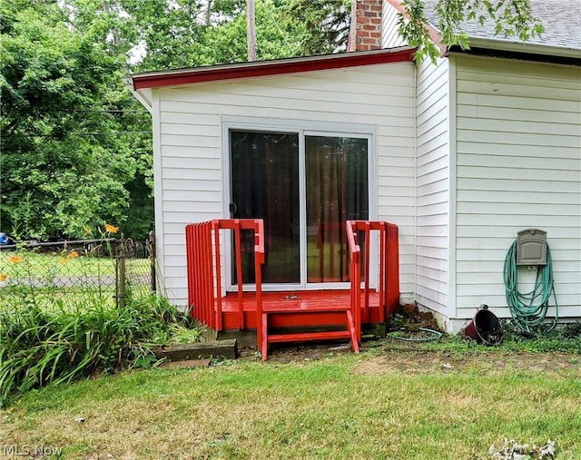 view of outbuilding featuring a lawn