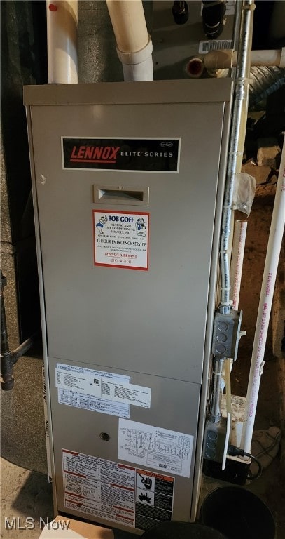 utility room featuring heating unit