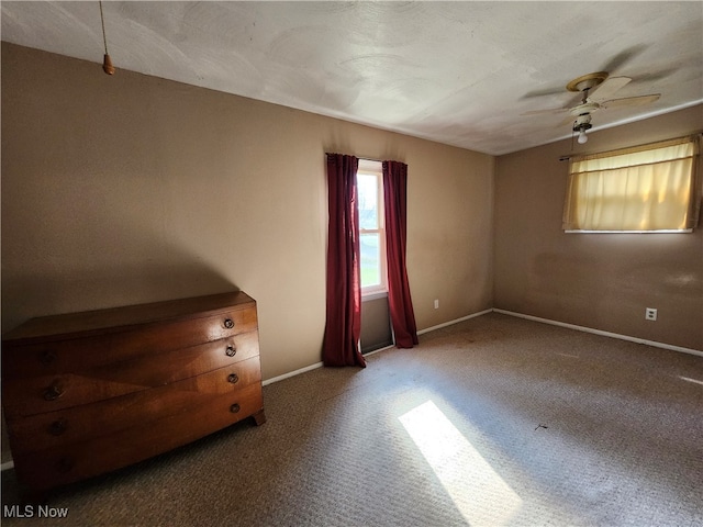 unfurnished room with carpet floors and ceiling fan