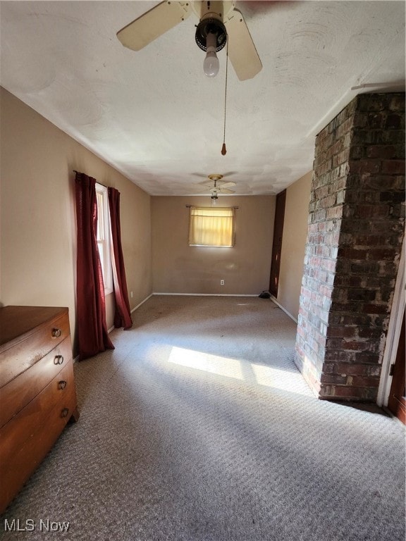 spare room with light carpet and ceiling fan