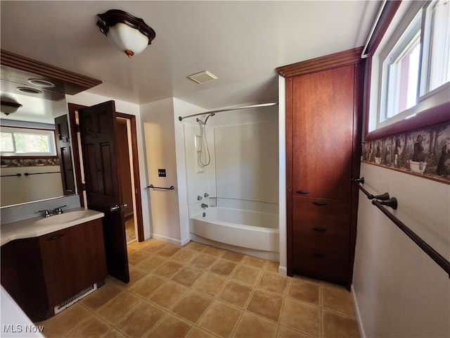 bathroom with vanity and washtub / shower combination