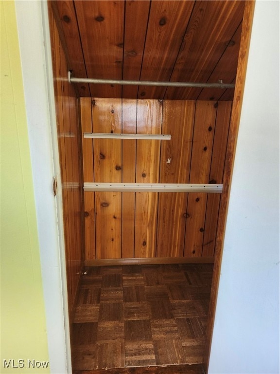 interior space with parquet flooring and wood ceiling