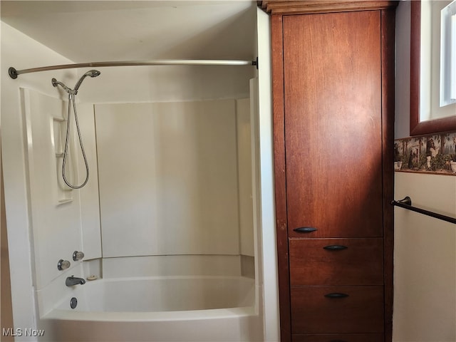 bathroom with washtub / shower combination