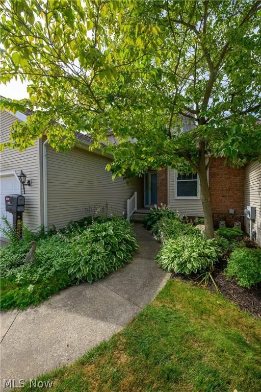 obstructed view of property with a garage