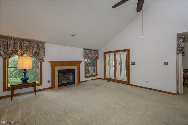 unfurnished living room with ceiling fan, light carpet, and high vaulted ceiling