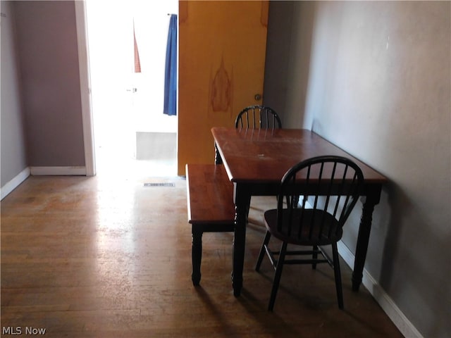 dining area featuring hardwood / wood-style flooring