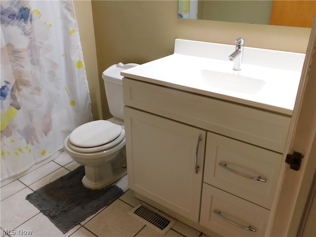 bathroom with vanity, toilet, tile patterned floors, and curtained shower