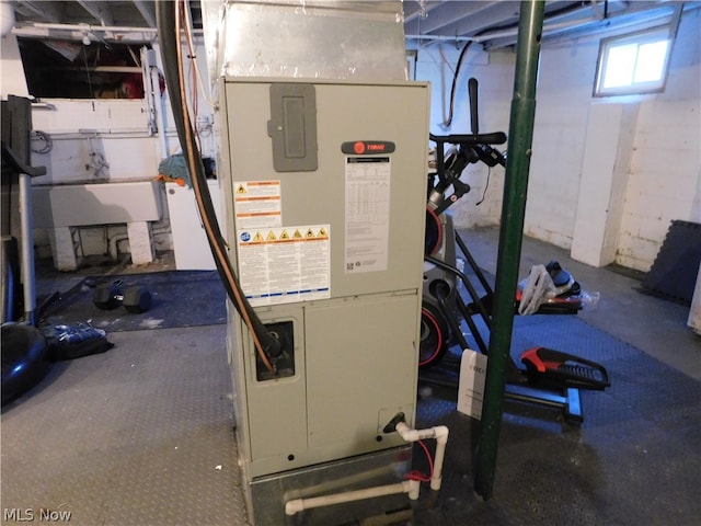 utility room with heating unit