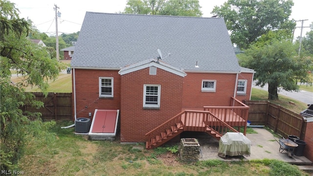 back of house with cooling unit