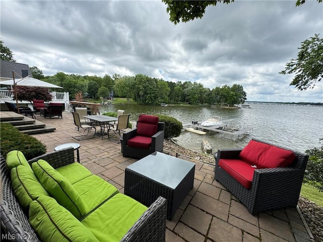 view of patio featuring an outdoor living space and a water view