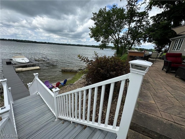 property view of water with a dock