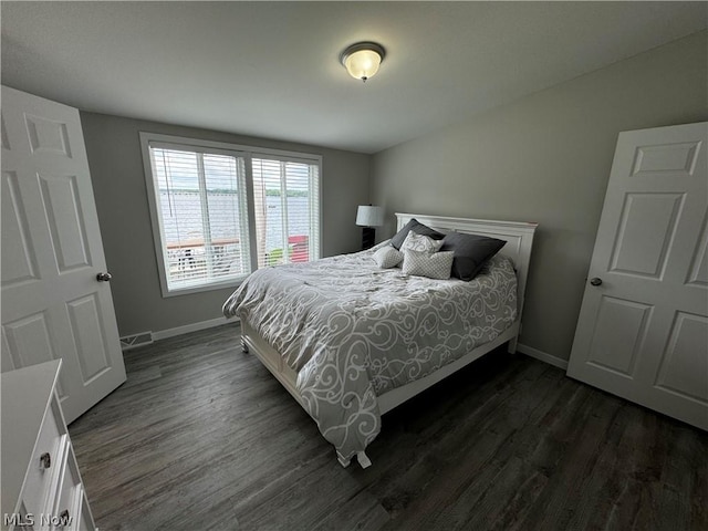 bedroom featuring dark hardwood / wood-style floors