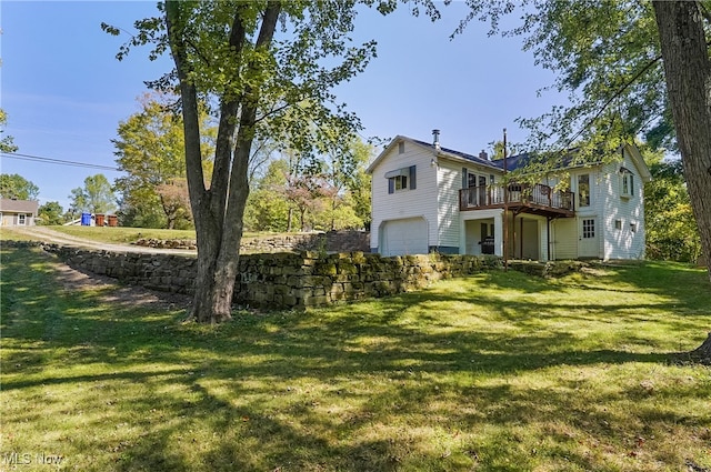 view of yard with a garage and a wooden deck