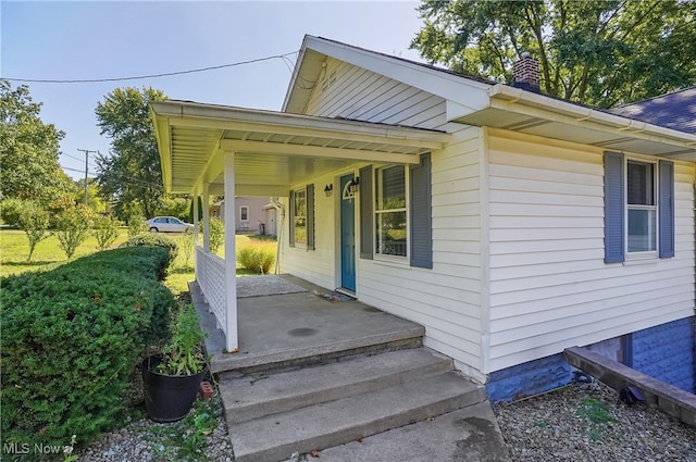 doorway to property with covered porch