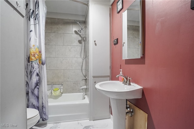 bathroom with toilet and shower / tub combo with curtain