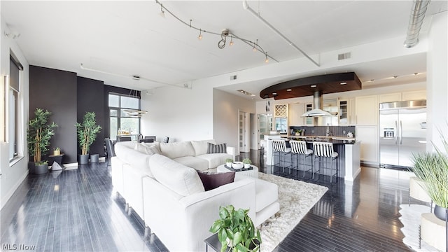 living room featuring dark wood-type flooring