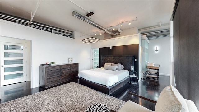 bedroom featuring dark wood-type flooring