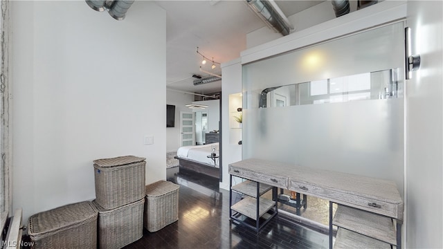 bathroom with hardwood / wood-style flooring