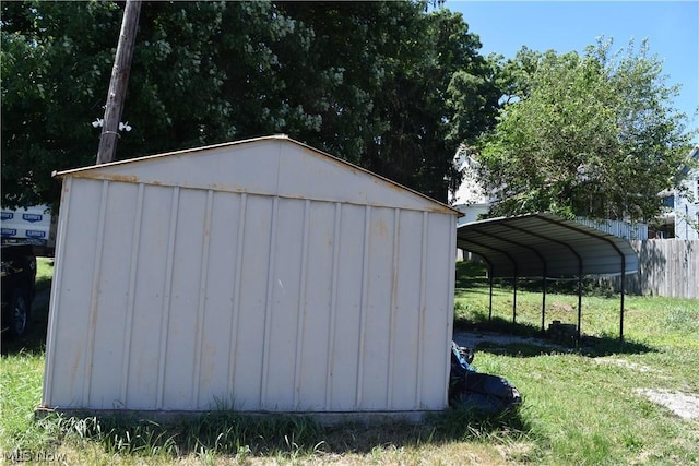 view of outbuilding with a detached carport