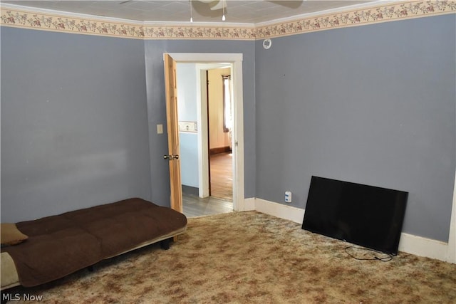 bedroom with baseboards, ornamental molding, and light colored carpet