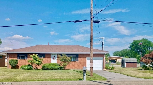 single story home with a garage and a front lawn