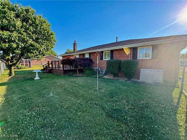 304 Stone Rd, Belpre, OH 45714 - back of house featuring a shed, a yard, and a wooden deck