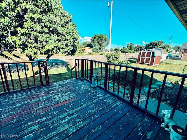 304 Stone Rd, Belpre, OH 45714 - deck featuring a storage unit and a lawn
