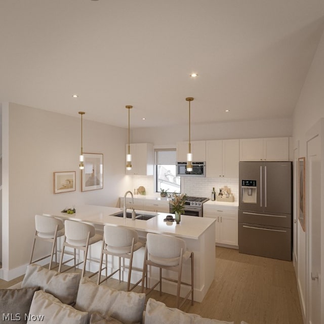 kitchen featuring light hardwood / wood-style flooring, white cabinets, backsplash, appliances with stainless steel finishes, and sink