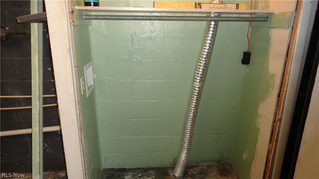 bathroom with concrete flooring