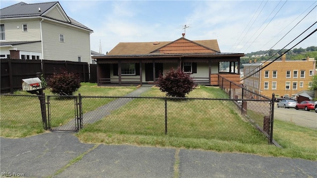 view of front of home with covered porch and a front yard