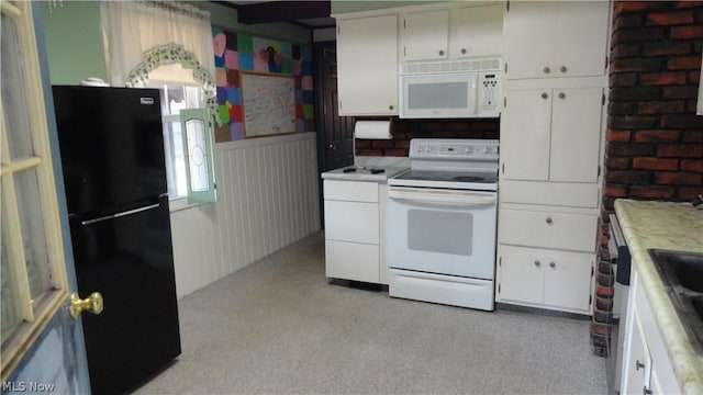 kitchen with white appliances and white cabinetry