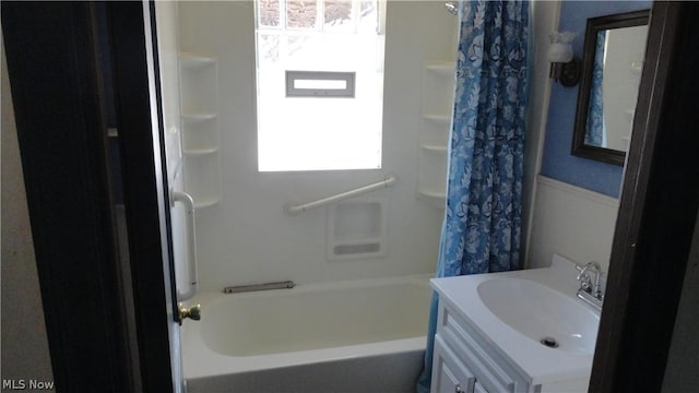 bathroom featuring vanity and shower / tub combo