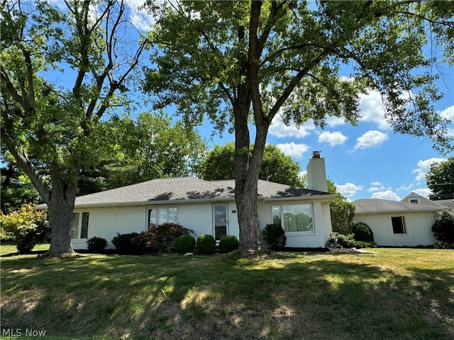 ranch-style home with a front yard