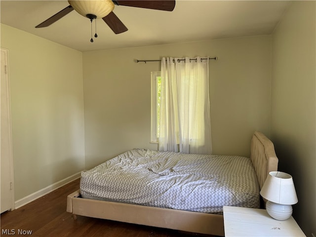 bedroom with ceiling fan and dark hardwood / wood-style floors