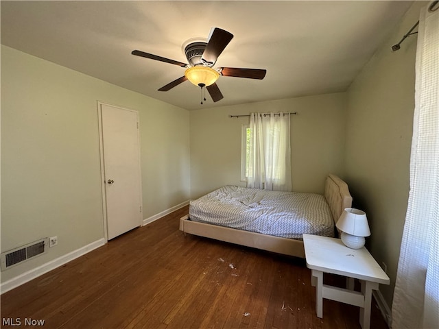 bedroom featuring ceiling fan and dark hardwood / wood-style flooring