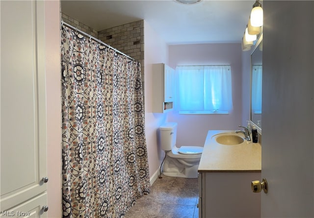 bathroom featuring tile patterned floors, toilet, and vanity