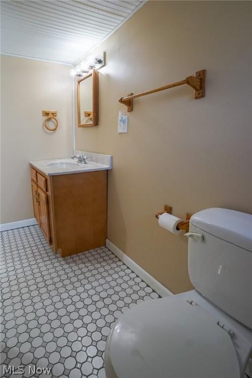 bathroom with toilet and vanity