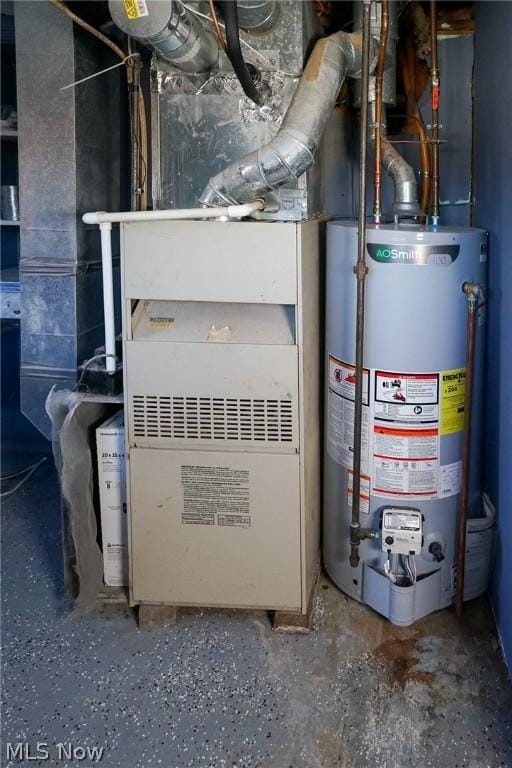 utility room featuring water heater