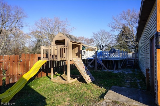 view of jungle gym with a lawn