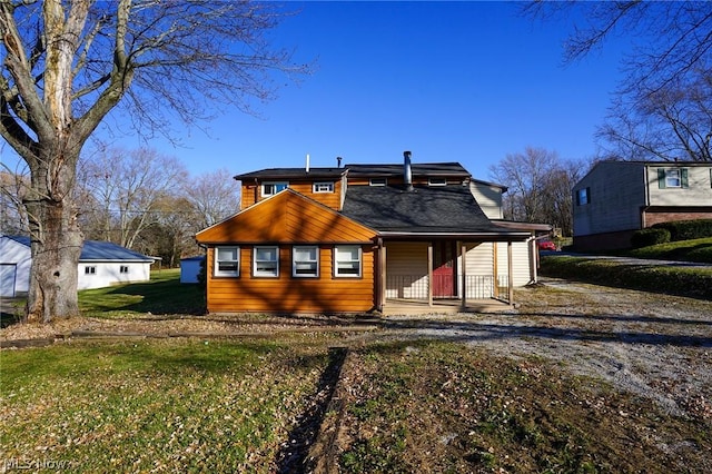 view of front of property with a front lawn and a porch