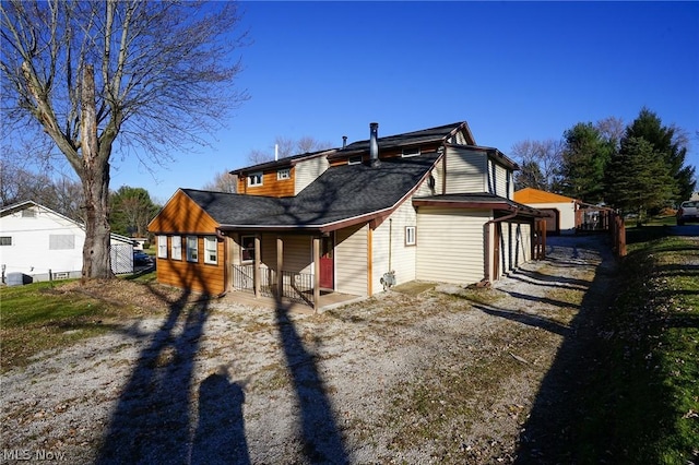 back of house with a porch