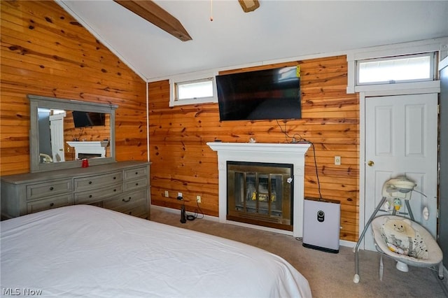 bedroom featuring wood walls and multiple windows