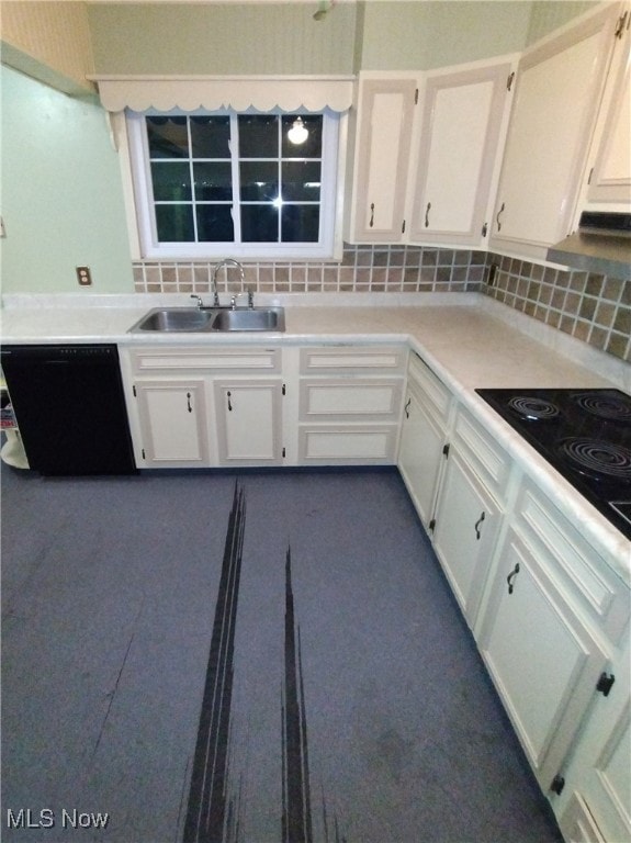 kitchen featuring tasteful backsplash, sink, white cabinets, and black appliances