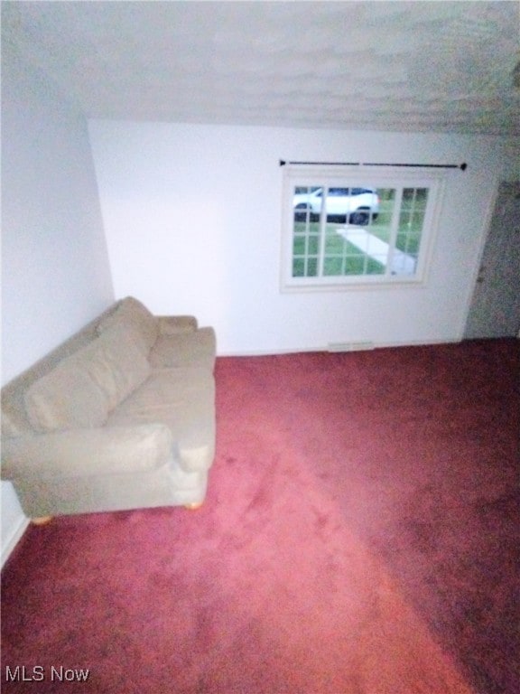 unfurnished living room with carpet